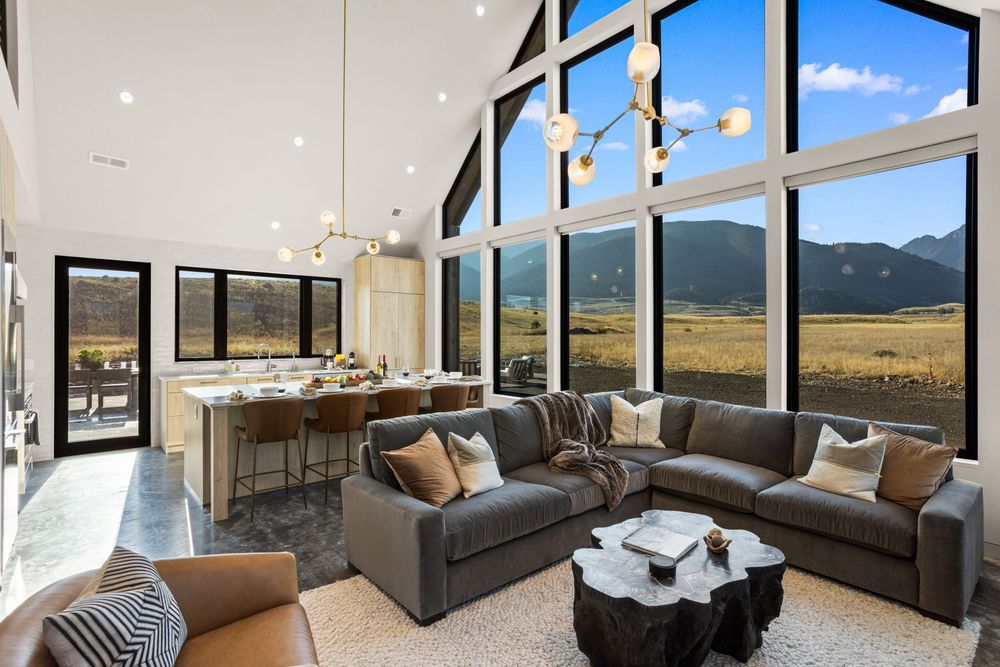 Double-height living room opening to the kitchen island