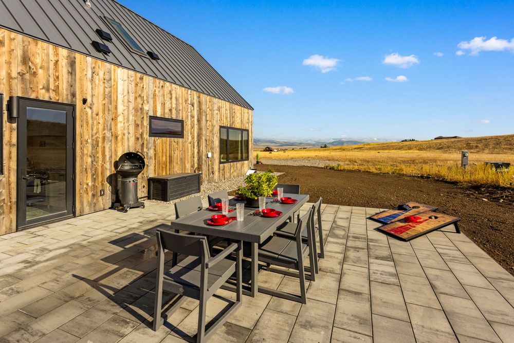 Outdoor dining table on the stone patio